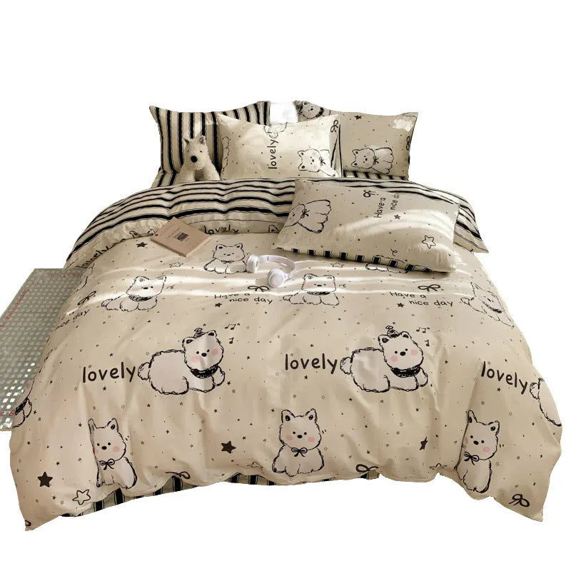 Cartoon dog pattern pure cotton four-piece quilt cover and bed sheet set on a bed