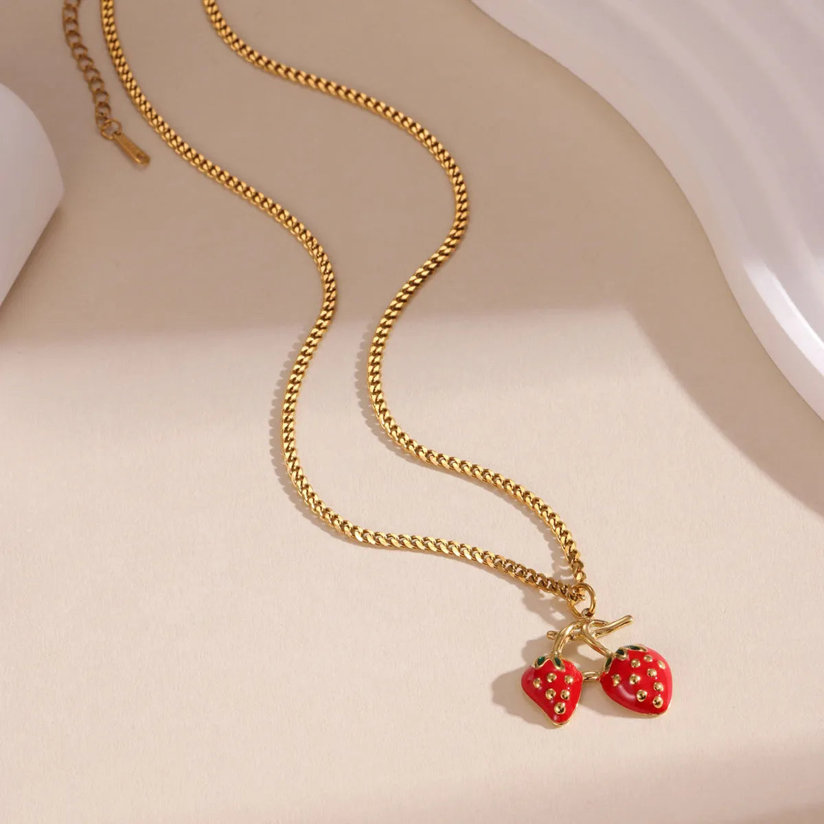 Red strawberry fruit pendant necklace on adjustable stainless steel chain