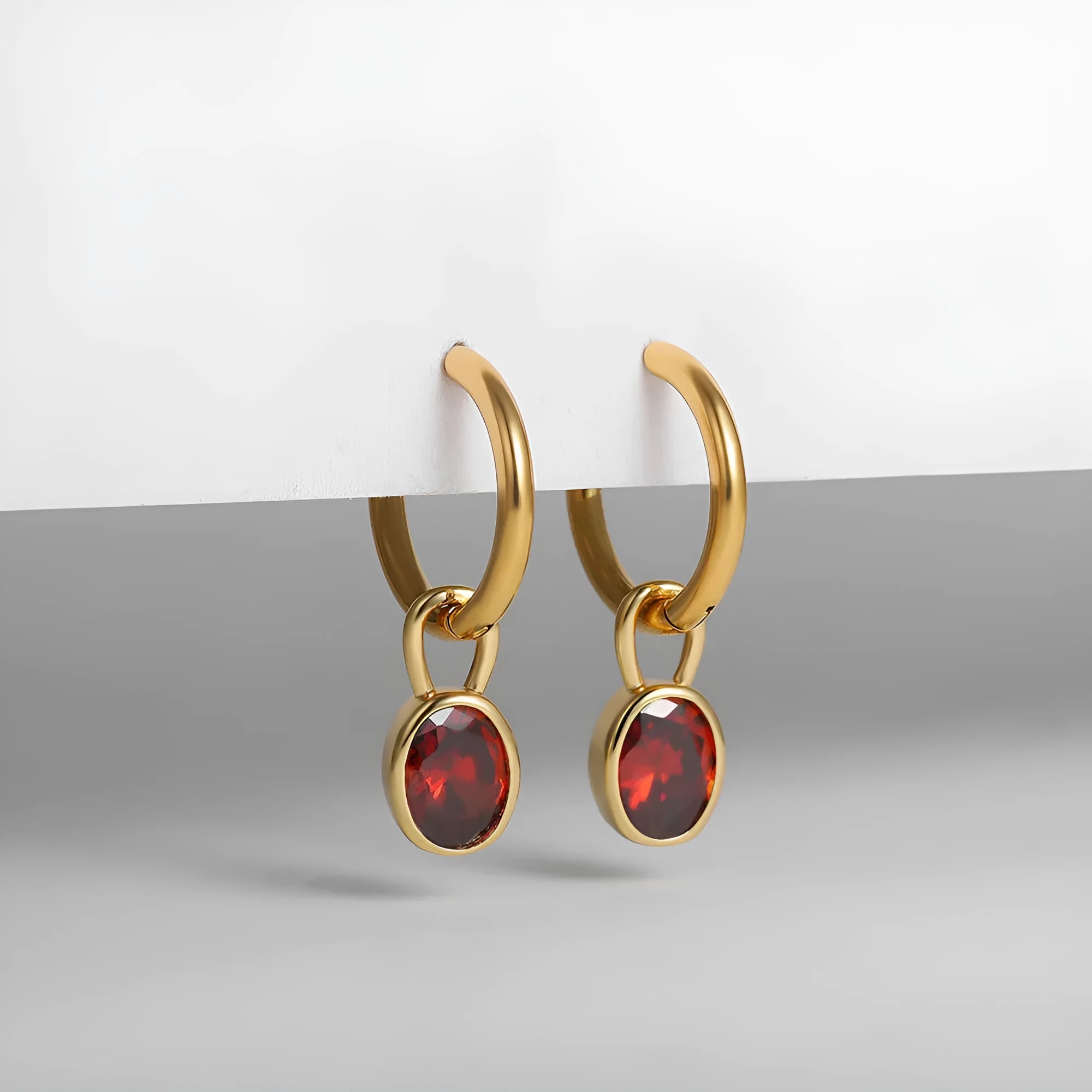 Women's retro-style oval zircon earrings in copper, shown in six colour options on a white background.