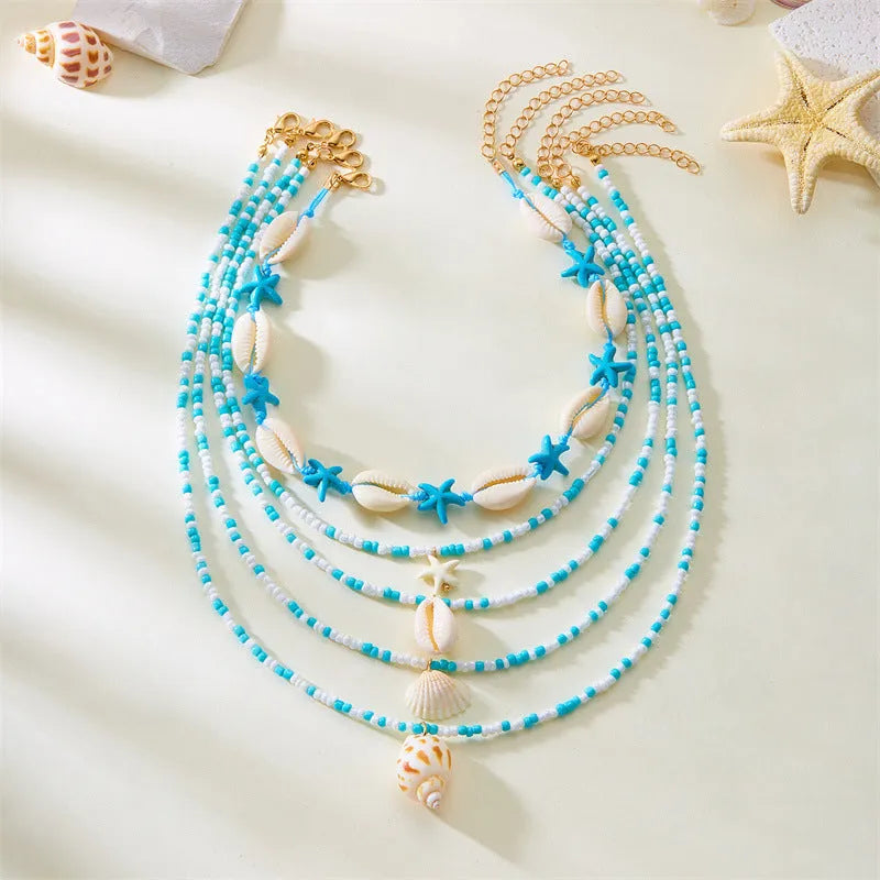 Blue shell and starfish pendant necklace set with five pieces on 21-50cm chains