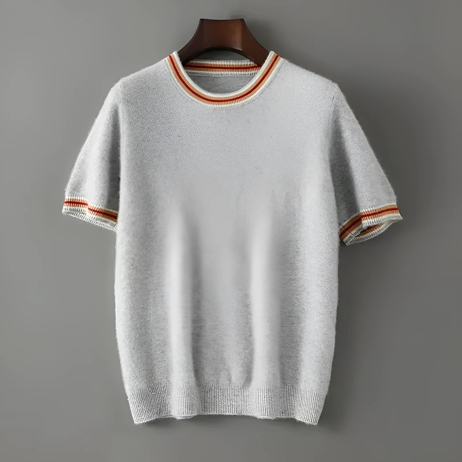Men's grey short sleeve wool sweater with a round neck, laid flat