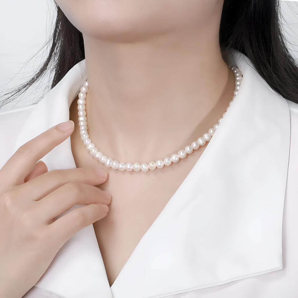 Women's adjustable sterling silver necklace with a single 6-7mm freshwater pearl pendant.
