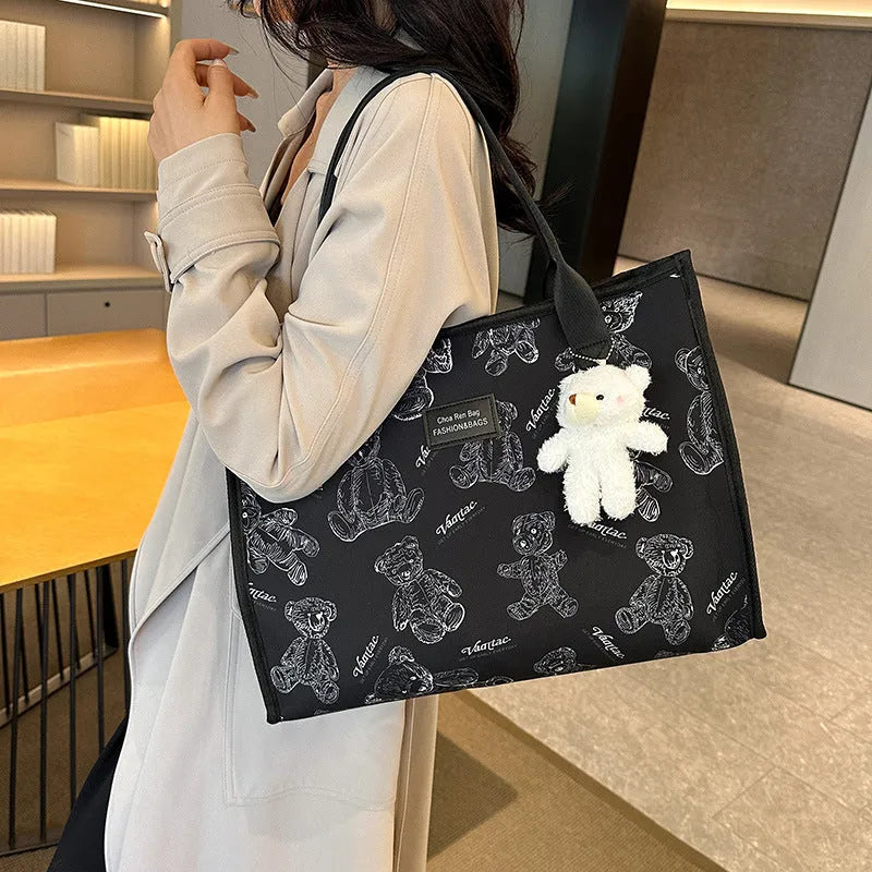 Women's black and white printed canvas tote bag with rhombus pattern and shoulder strap