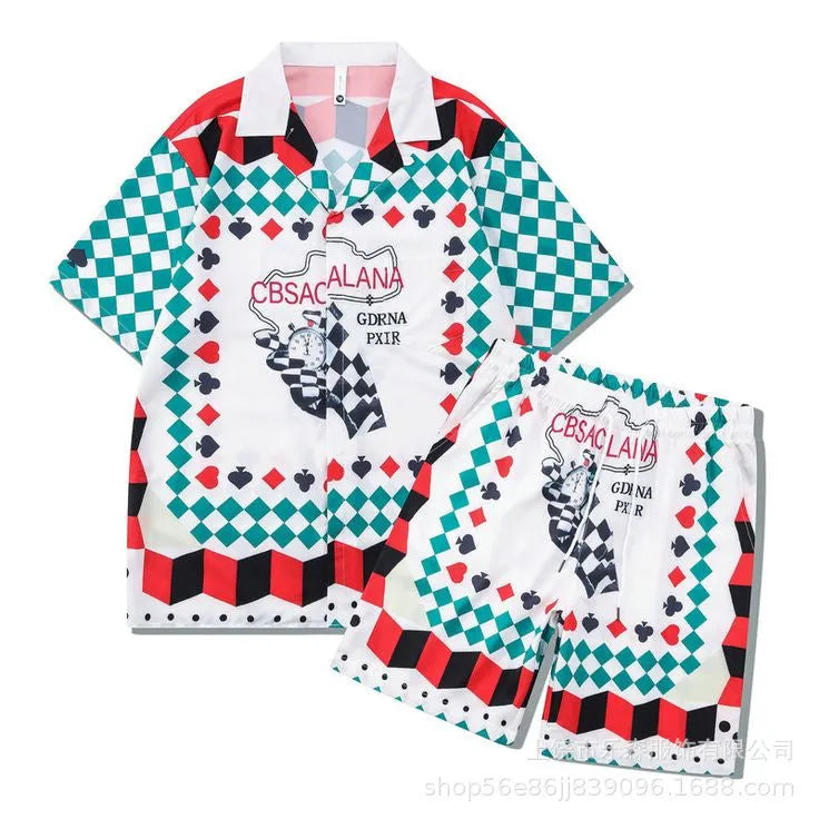 Men's plaid print beach outfit set with short sleeve shirt and pants on a hanger.