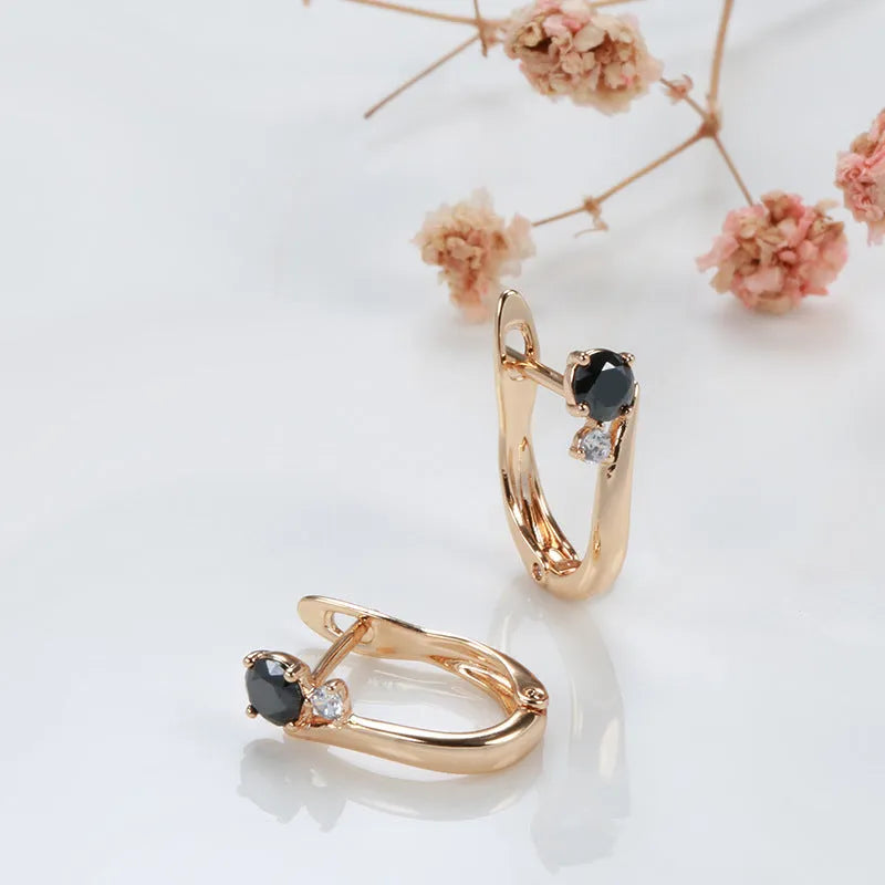 Gold colour geometric drop earrings with a black agate stone inlay for women.