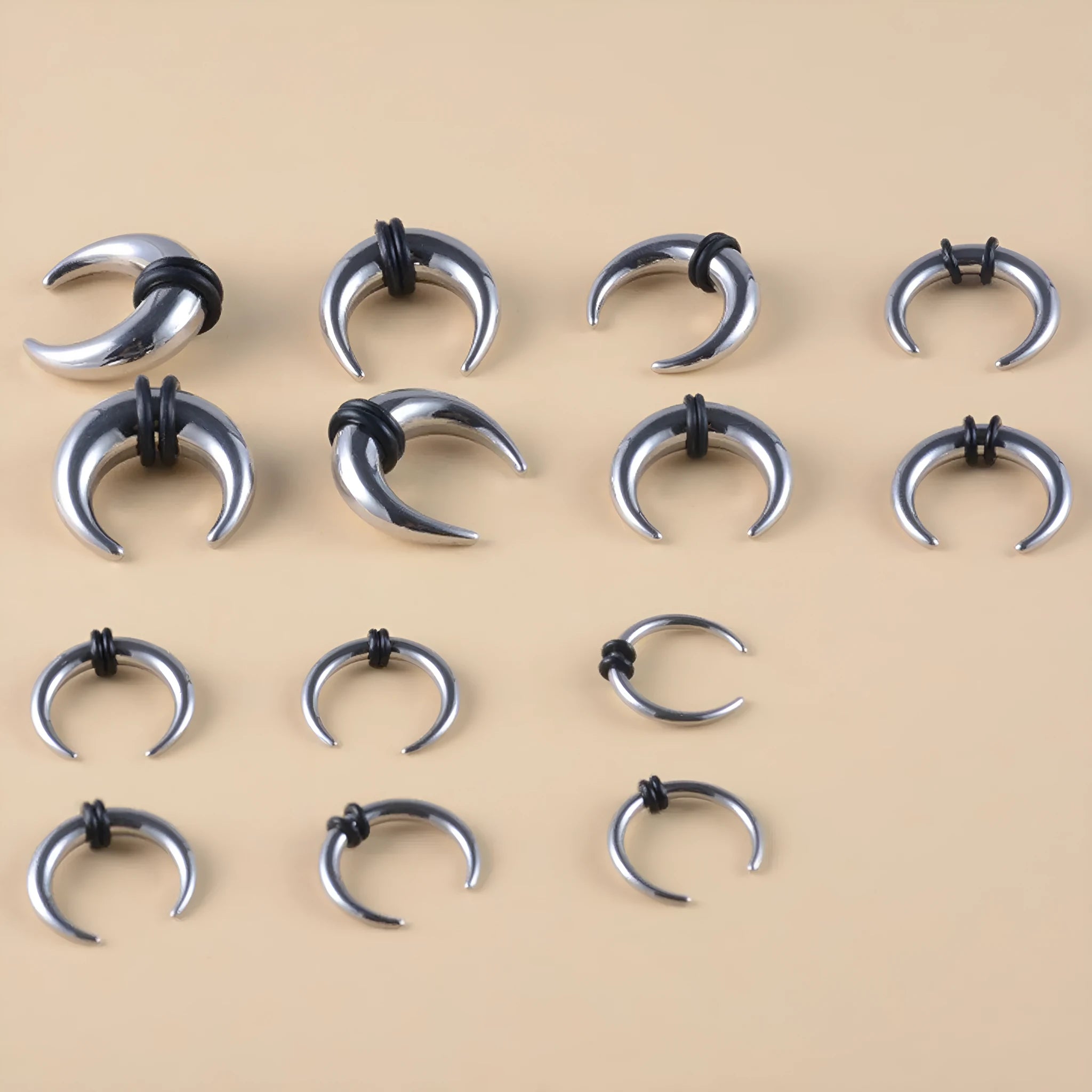 Black and steel coloured C-shaped 316 stainless steel nose ring with buffalo horn style.