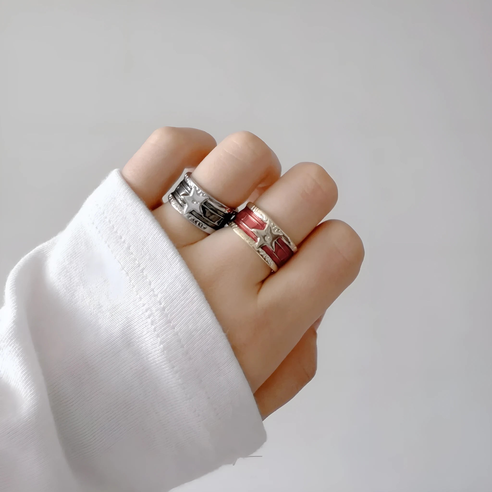 Geometric adjustable copper ring with a distressed finish in black, red, and blue colour options.