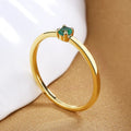 Women's copper geometric circle ring with a single round diamond, shown in multiple colour options.