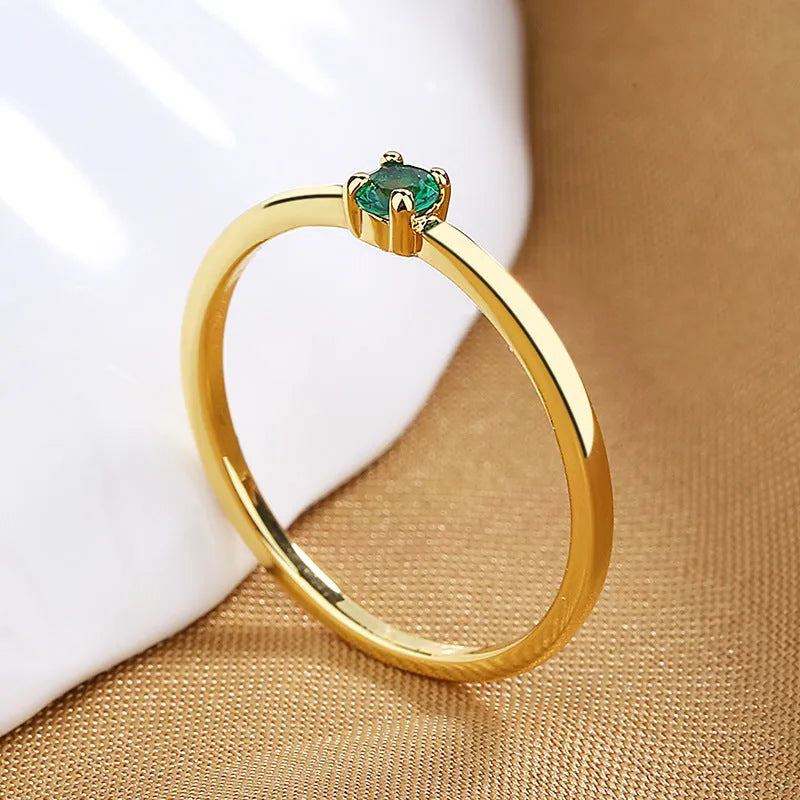Women's copper geometric circle ring with a single round diamond, shown in multiple colour options.