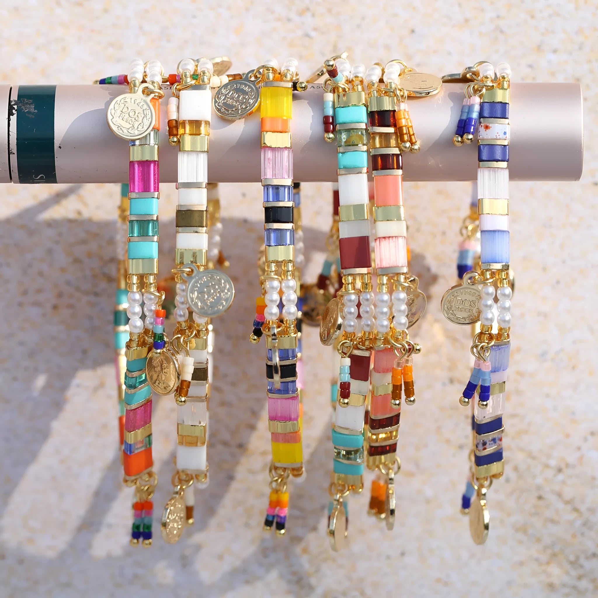 Women's adjustable bracelet with imitation pearls and coloured glass beads in a European design.