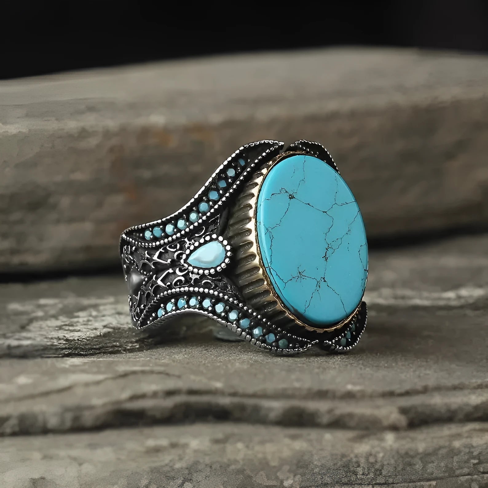 Men's antique silver turquoise ring showing round shape and polished metallic finish
