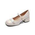 French style women's hiking boots with patent leather upper, buckle, chunky heel, and square toe in apricot colour.