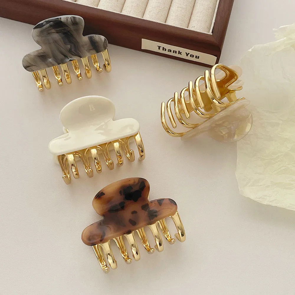 Retro acetate hair barrettes with metal grip in four colour variations including leopard print