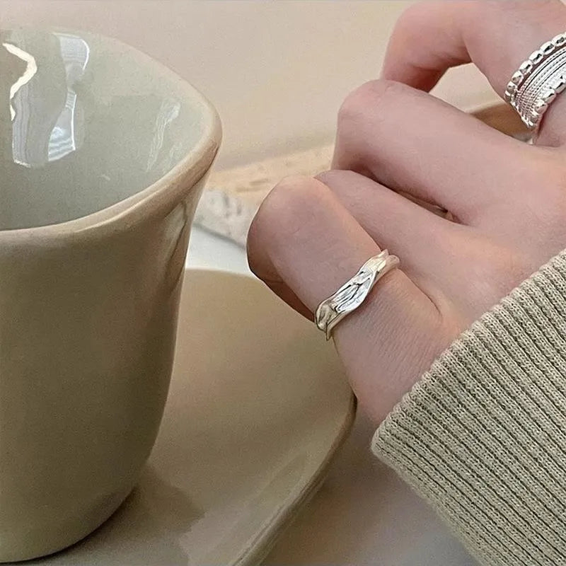 Adjustable opening geometric copper ring with woven twisted multilayer design