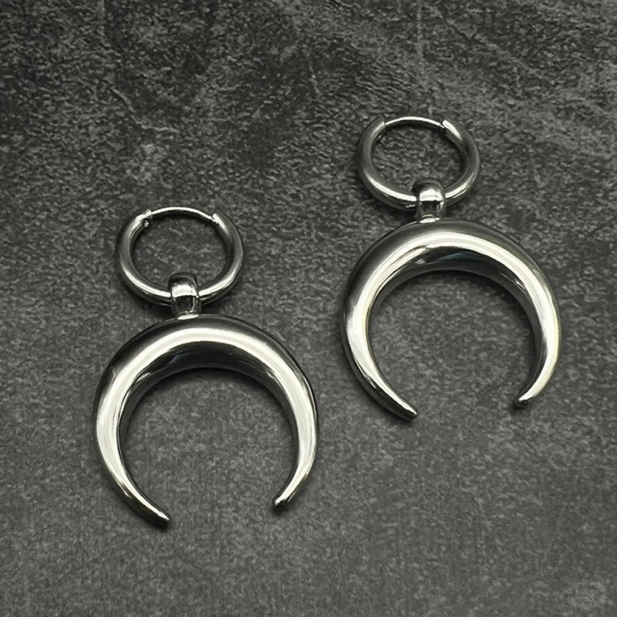 Silver geometric hoop earrings with moon decoration and clip-on fastenings