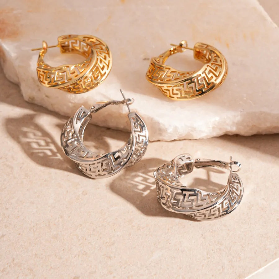 Geometric hollow stud earrings with twisted round design in silver or gold finish