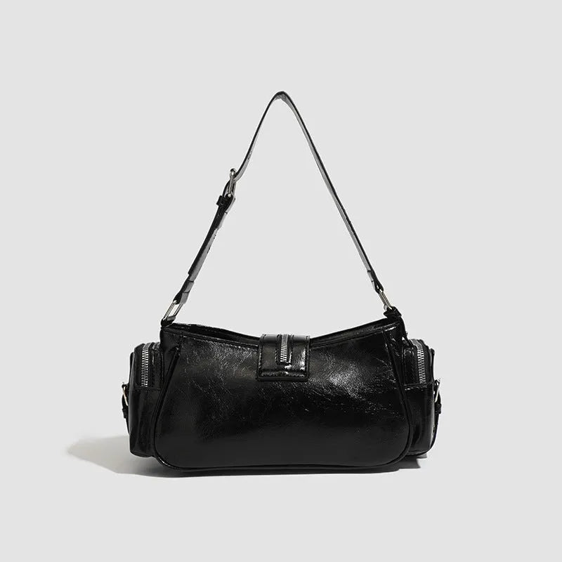 Black retro-style dumpling handbag with three-dimensional pockets and multiple interior organisers