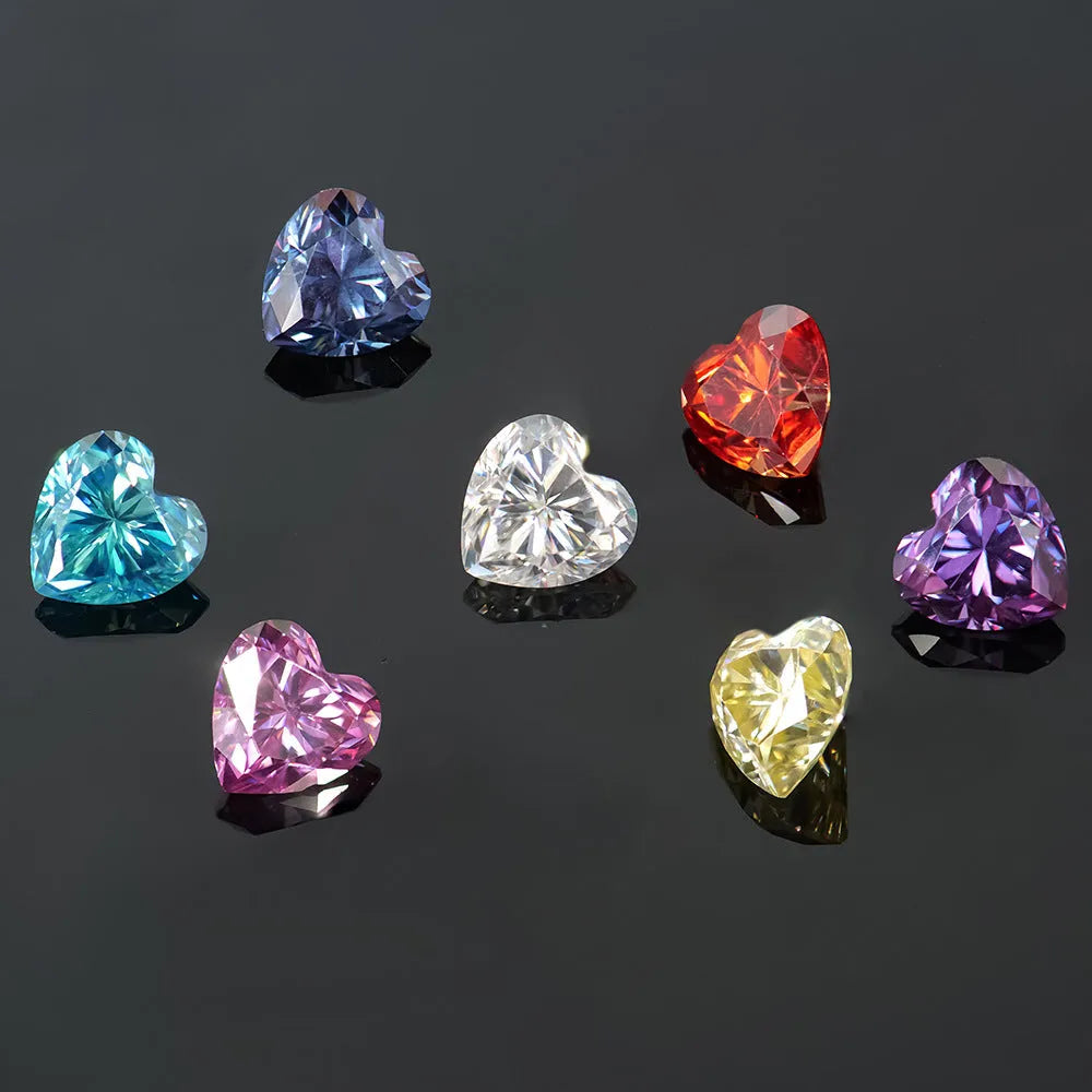Colourful heart-shaped moissanite stone in lemon yellow, red, pink, blue and purple colours