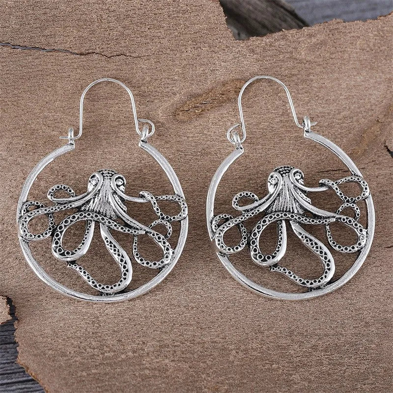 Vintage antique silver octopus earrings with detailed tentacles, retro animal zodiac design.
