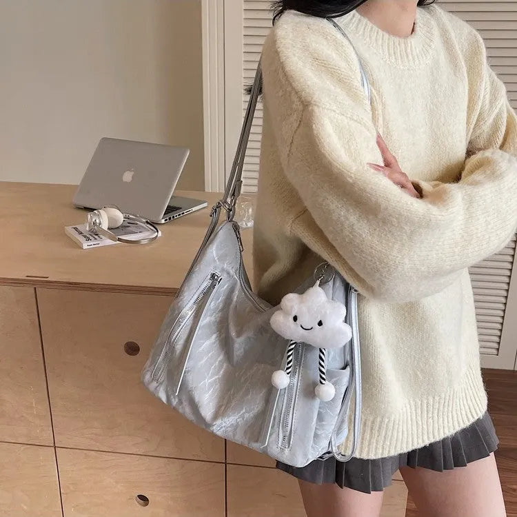 Women's soft PU fashion backpack with pendant accessory in black, milky white, silver or blue colour