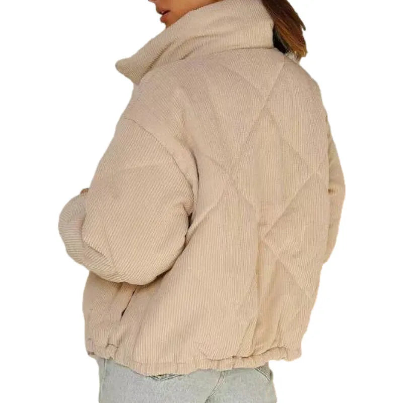 Apricot coloured women's corduroy jacket with stand collar, front zipper, and long sleeves.