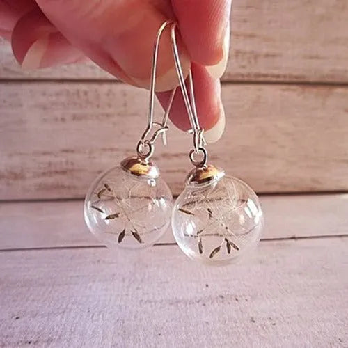 Transparent glass ball earrings with dandelion seed design on a French hook