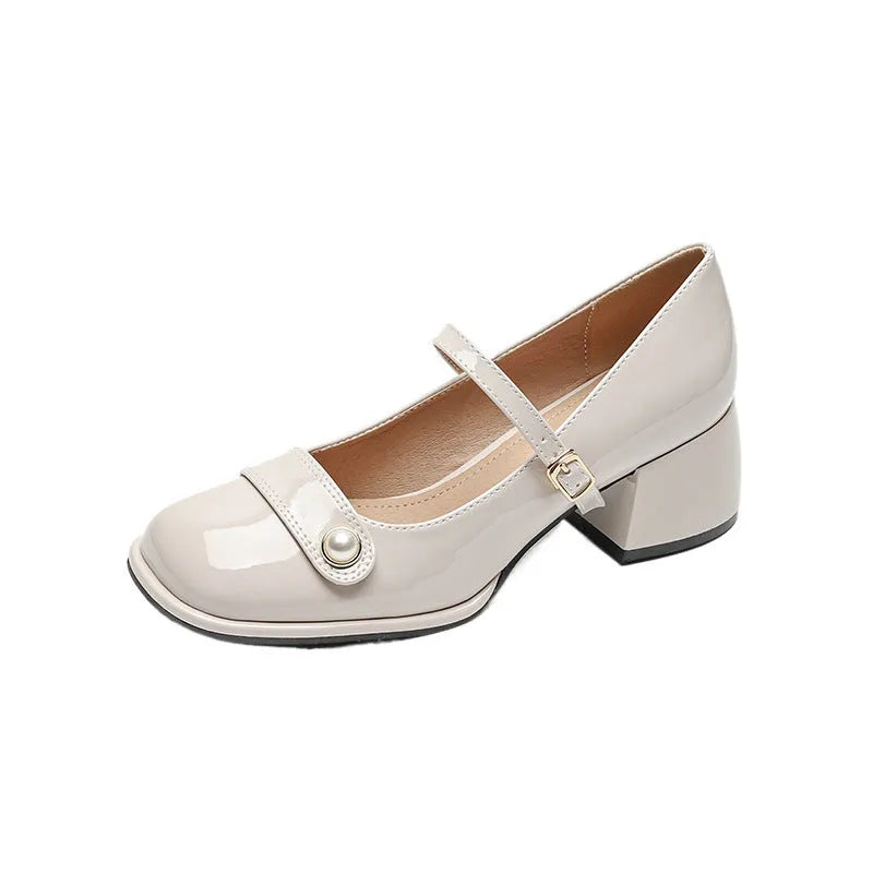 French style women's hiking boots with patent leather upper, buckle, chunky heel, and square toe in apricot colour.