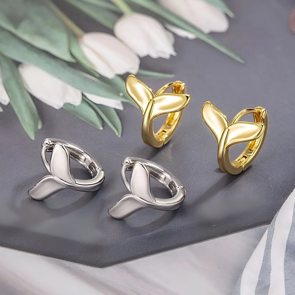 Women's fishtail design earrings in electroplated gold finish on copper
