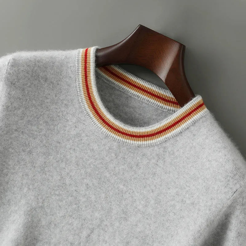 Men's grey short sleeve wool sweater with a round neck, laid flat