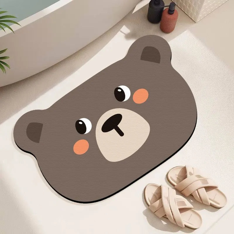 Colourful cartoon animal diatomite absorbent bathroom mat in alien shape on tiled floor.