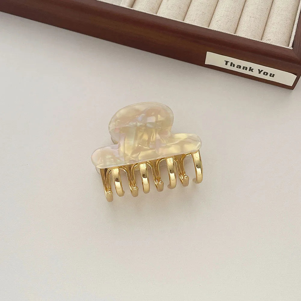 Retro acetate hair barrettes with metal grip in four colour variations including leopard print