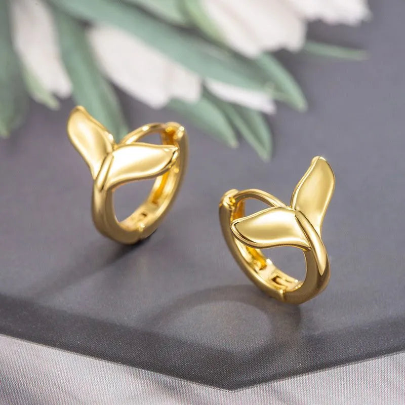 Women's fishtail design earrings in electroplated gold finish on copper