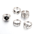 Black alloy poker ring with raised spade card design and adjustable band