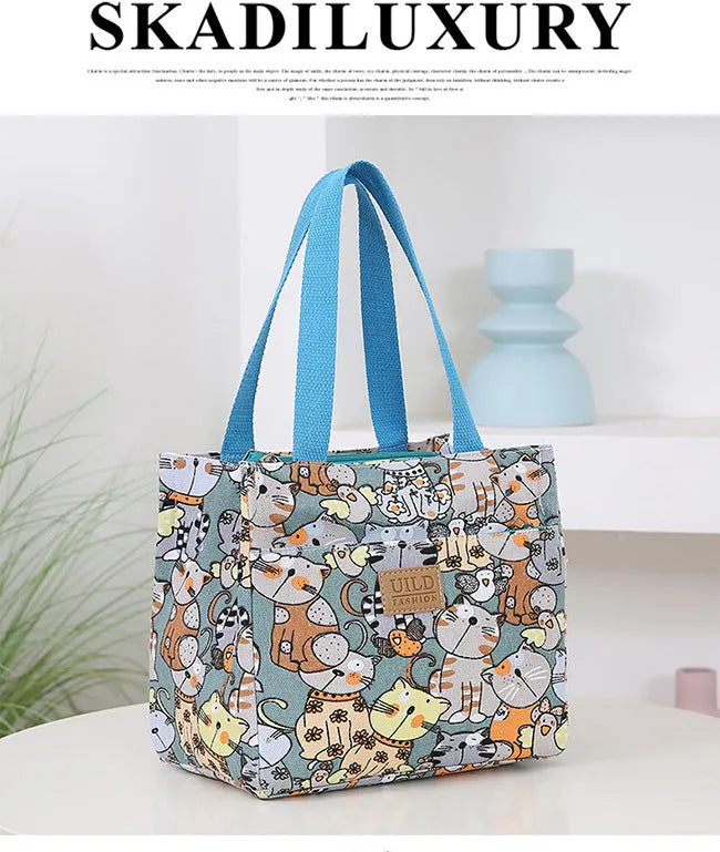 Women's printed canvas handbag with aluminium frame in multiple floral and animal print designs