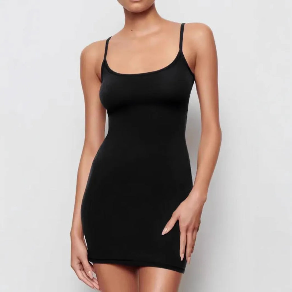 Black sleeveless sling dress with skinny sheath silhouette and mid waist design
