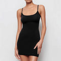 Black sleeveless sling dress with skinny sheath silhouette and mid waist design