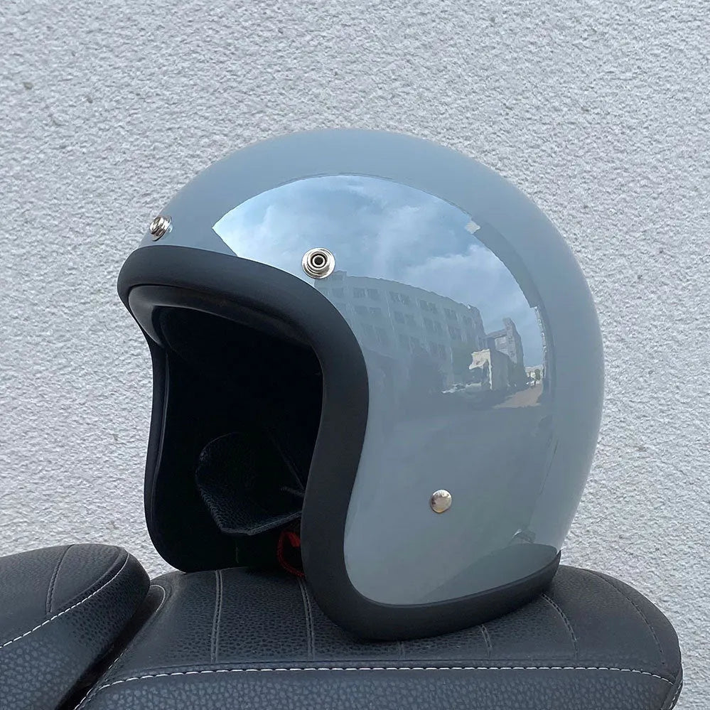 A cement grey retro-style half motorcycle helmet made from FRP glass fibre, shown on a white background.