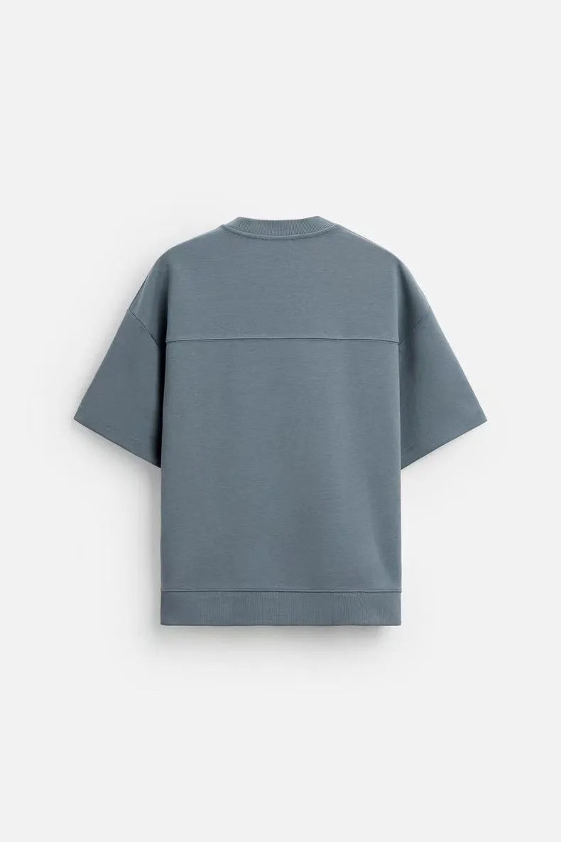 Loose double-sided cloth texture short sleeve top and matching shorts casual set on a hanger.