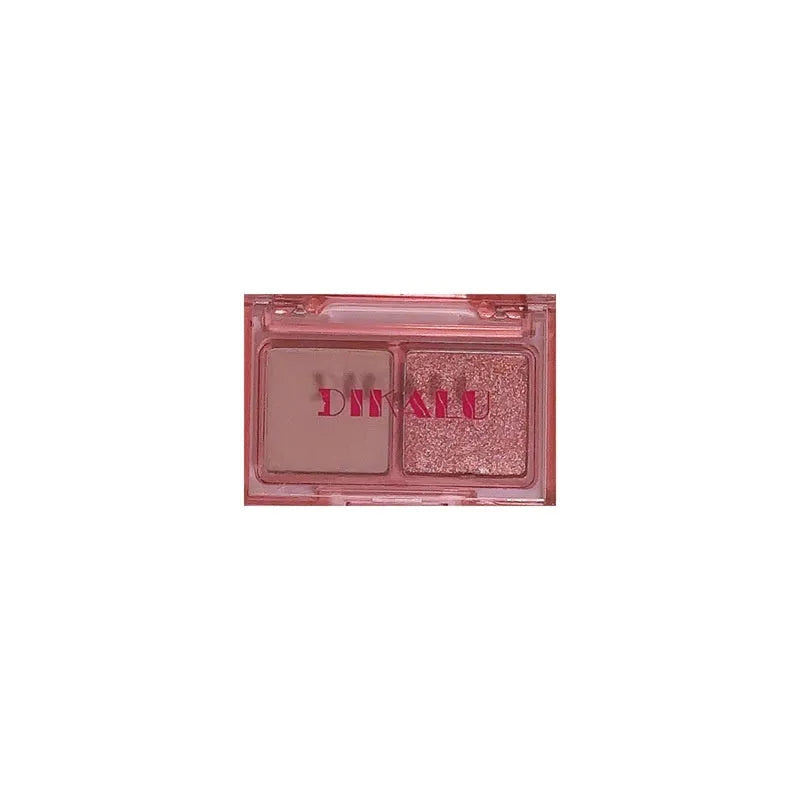 Cool two-tone eyeshadow palette showing pink and black matte and shimmer shades for punk and festival makeup looks
