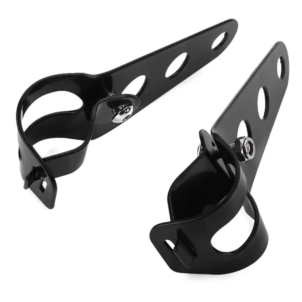A pair of black iron motorcycle headlamp support brackets for retro bike modification.