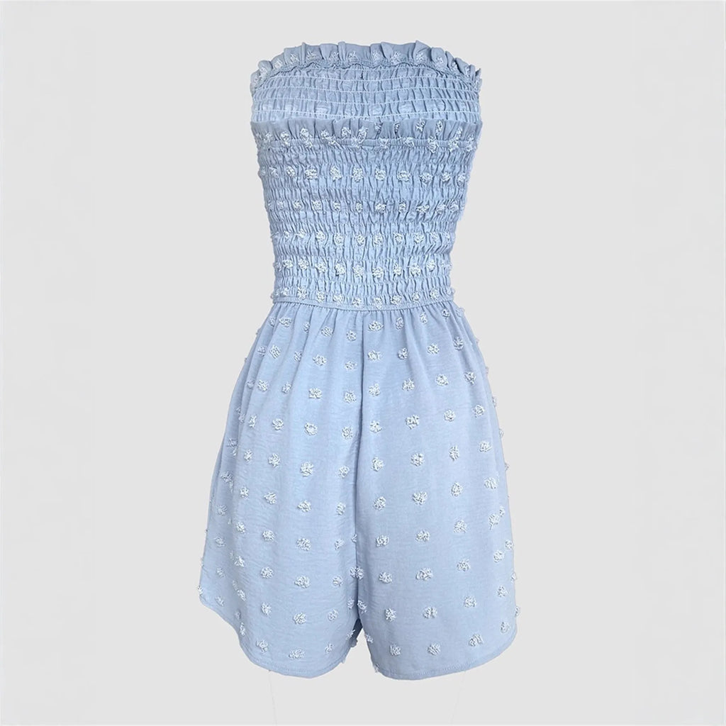 Women's sleeveless off-shoulder jumpsuit in polyester fabric showing button detailing and elastic waist