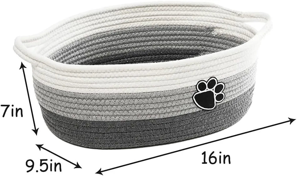 Small light beige hand-woven cotton rope storage basket with a wooden base and a handle.