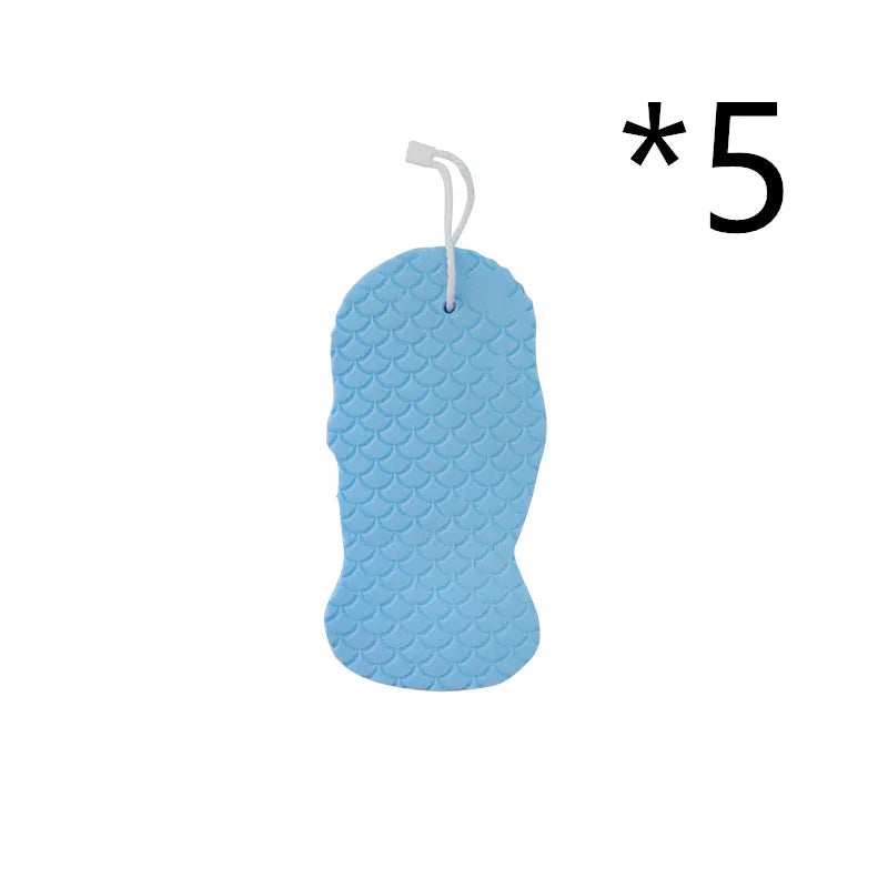 3D fish scale pattern bath sponge ball in assorted colours on a bathroom background.