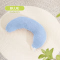 Blue U-shaped cat pillow with an adjustable fabric collar for neck support on a grey sofa