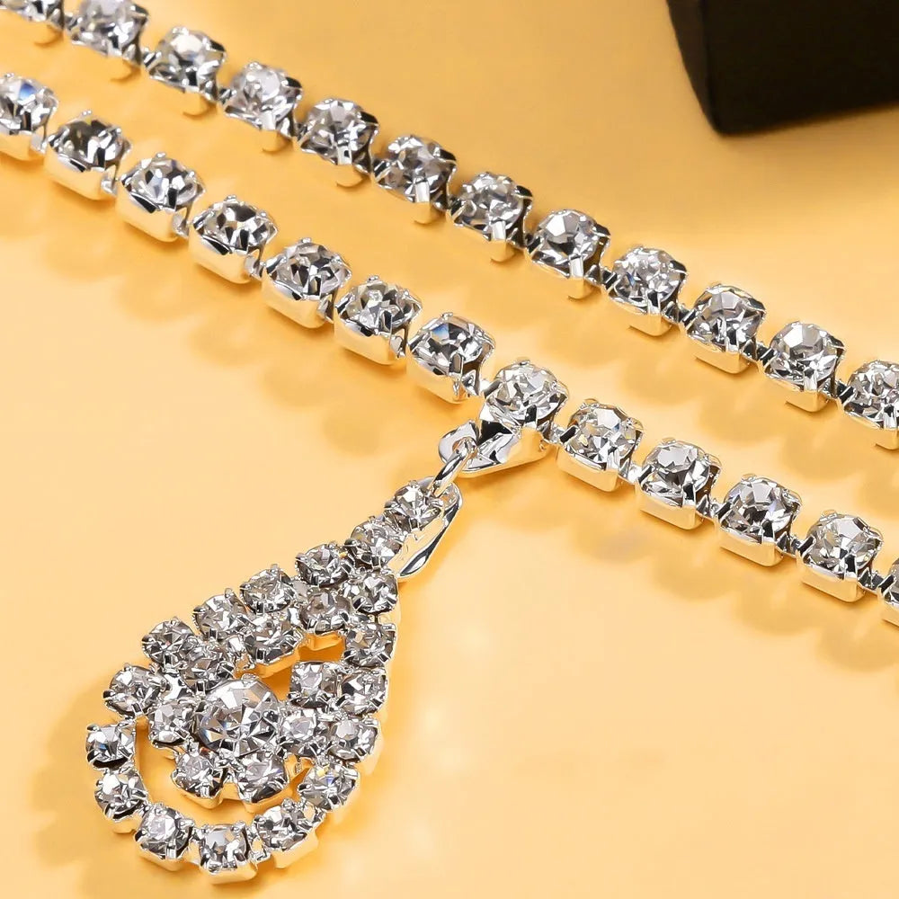 Gold waist chain with rhinestone decoration and lobster buckle clasp measuring 105cm length