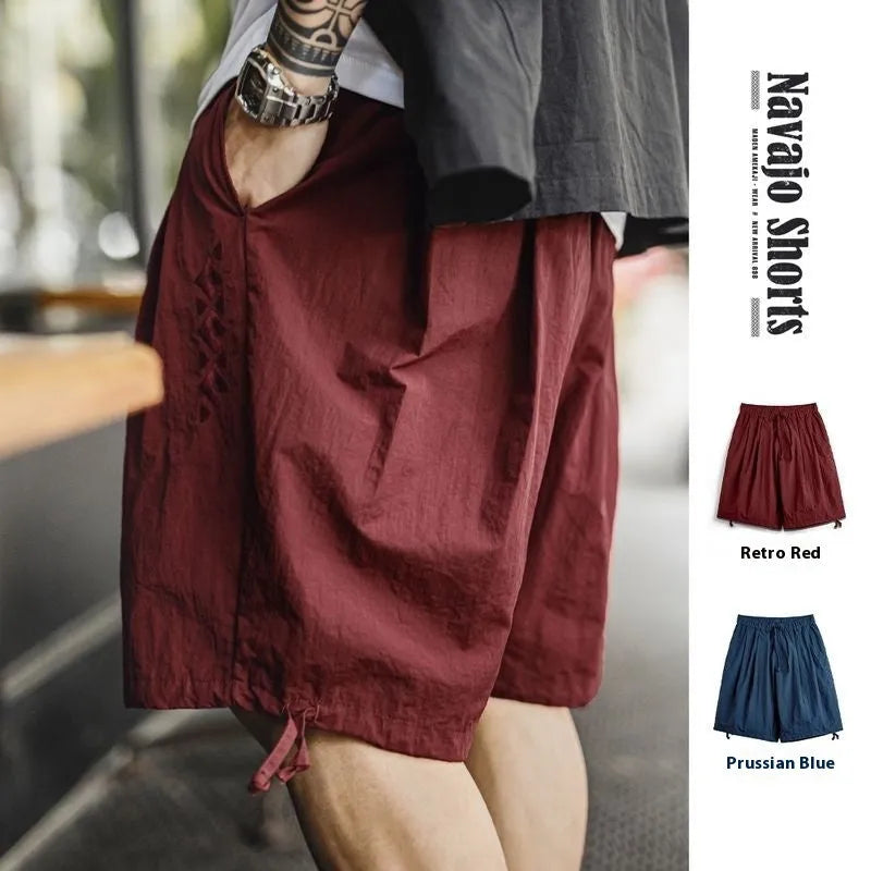 Men's Prussian Blue nylon beach shorts with embroidery and loose fit design