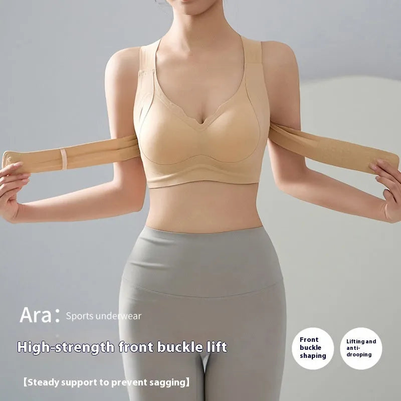 Women's black sports bra with front buckle closure and back shaping, shown on a size mannequin.