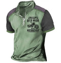 Men's casual polo shirt with lapel collar, digital letter printing, and zipper decorations on short sleeves.