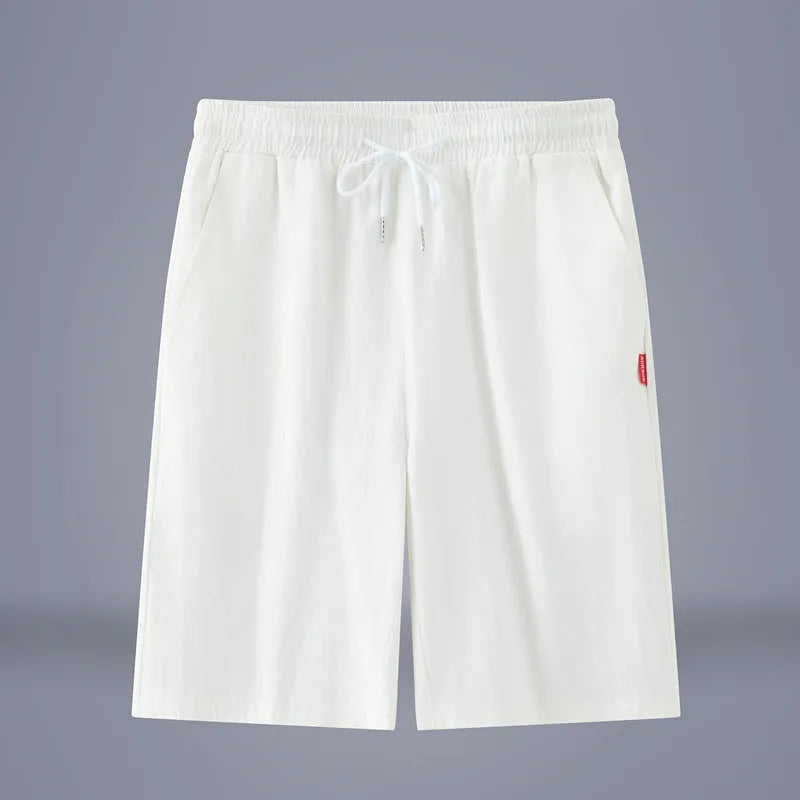 Solid colour cotton linen cropped summer pants on a hanger, showing mid-waist and drawstring detail.