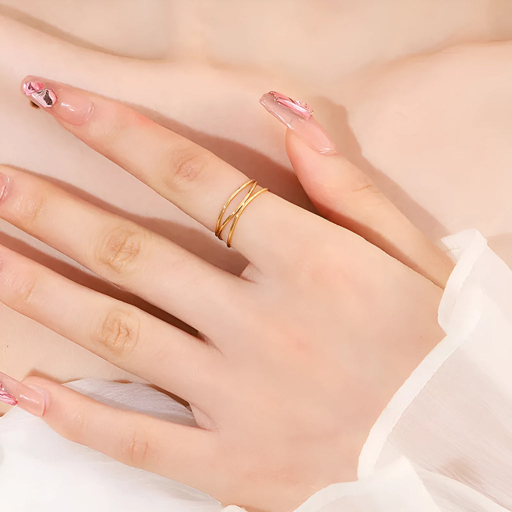 Gold colour titanium steel women's ring with three-layer geometric line design in coiled construction